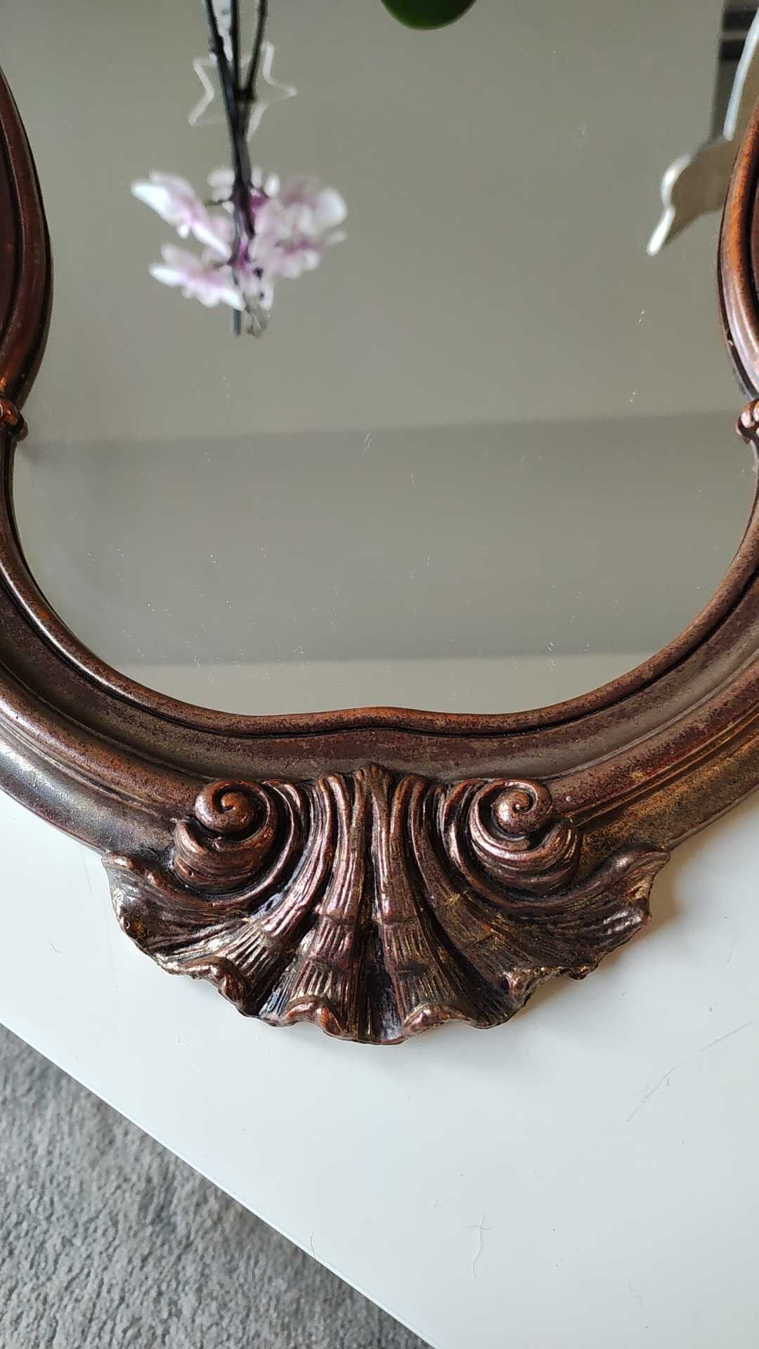 Pretty Baroque style mirror / Louis XV patinated with pink / golden copper reflections. Volutes, leafy shells