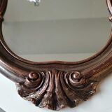 Pretty Baroque style mirror / Louis XV patinated with pink / golden copper reflections. Volutes, leafy shells