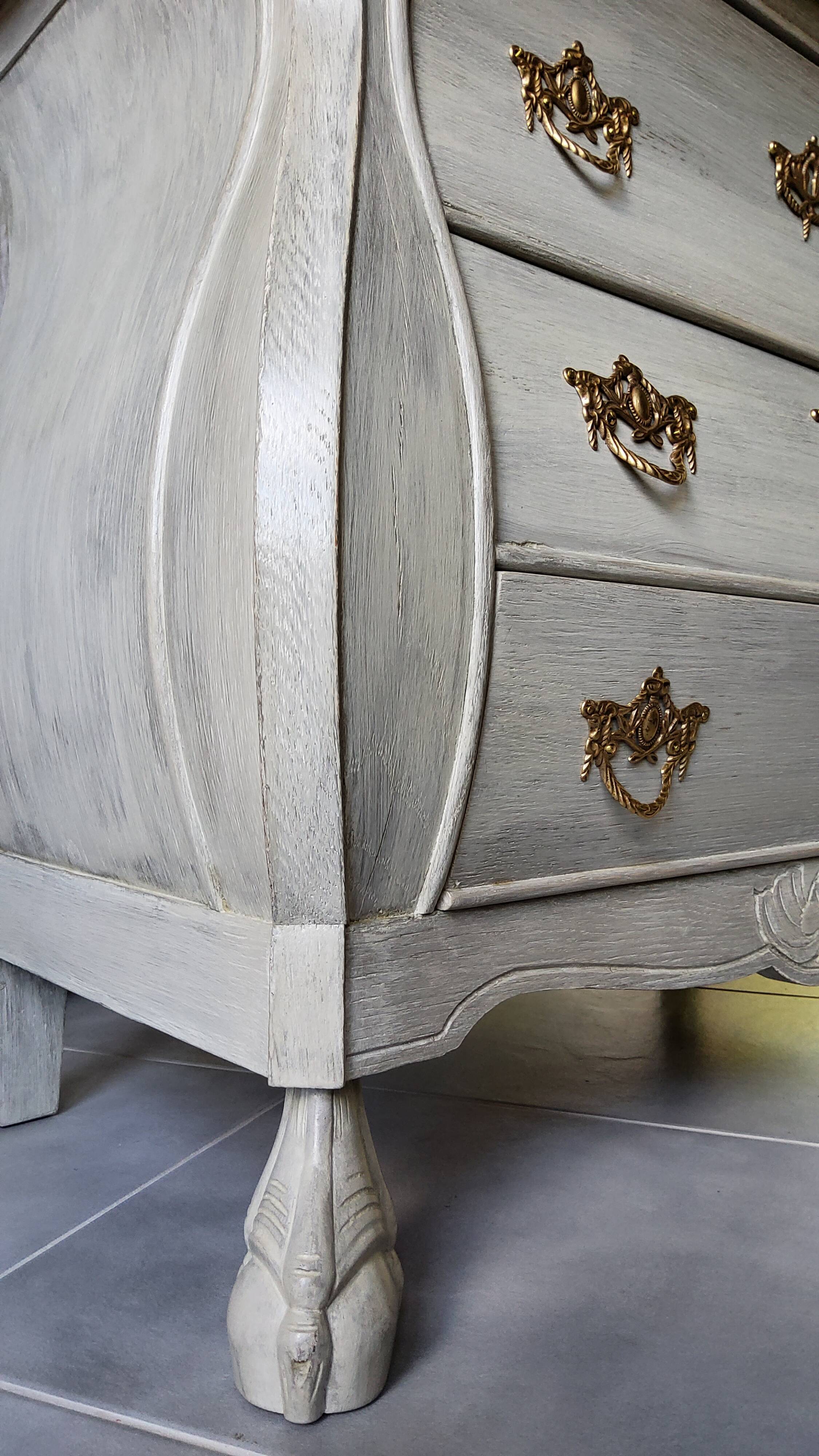 Curved patinated chest of drawers