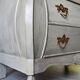 Curved patinated chest of drawers