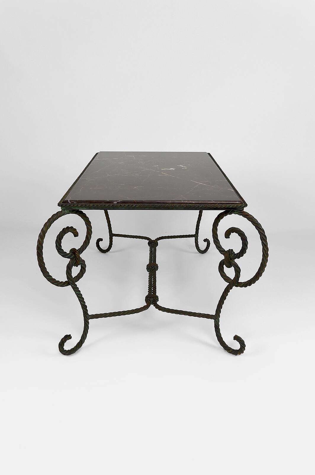 Coffee table in patinated wrought iron and black marble, circa 1940