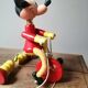 Old Mickey Mouse toy on his wooden tricycle