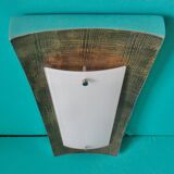 Pair of wall sconces in gold-plated alloy with bas-relief and opaline glass. Germany, 1980