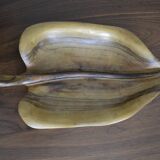 Wooden top in the shape of a leaf