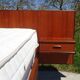 Vintage bed in teak with integrated bedside table.