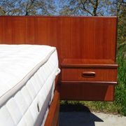 Vintage bed in teak with integrated bedside table.