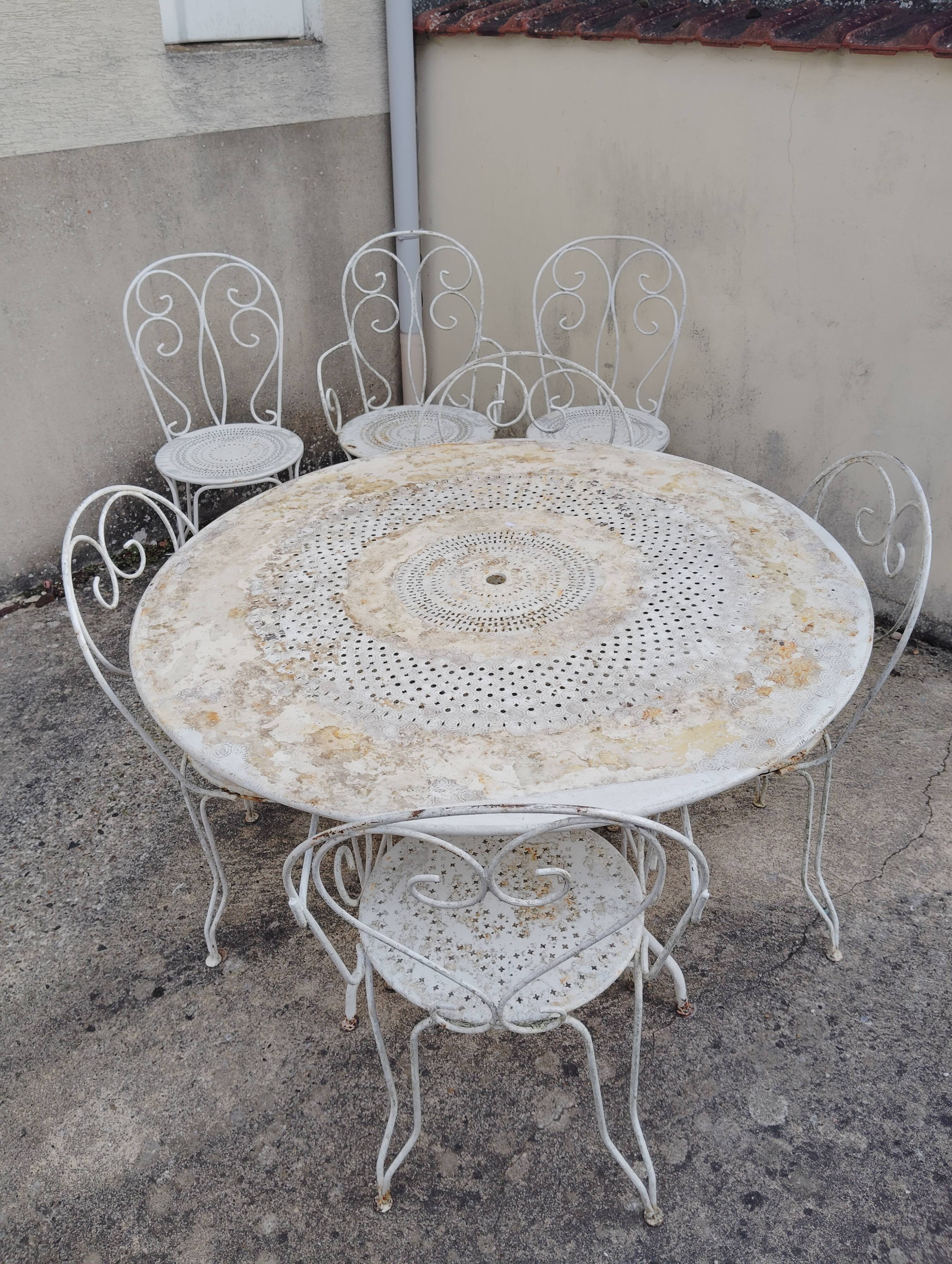 Wrought iron garden furniture from the early 20th century.