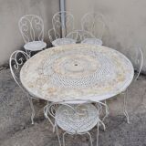 Wrought iron garden furniture from the early 20th century.