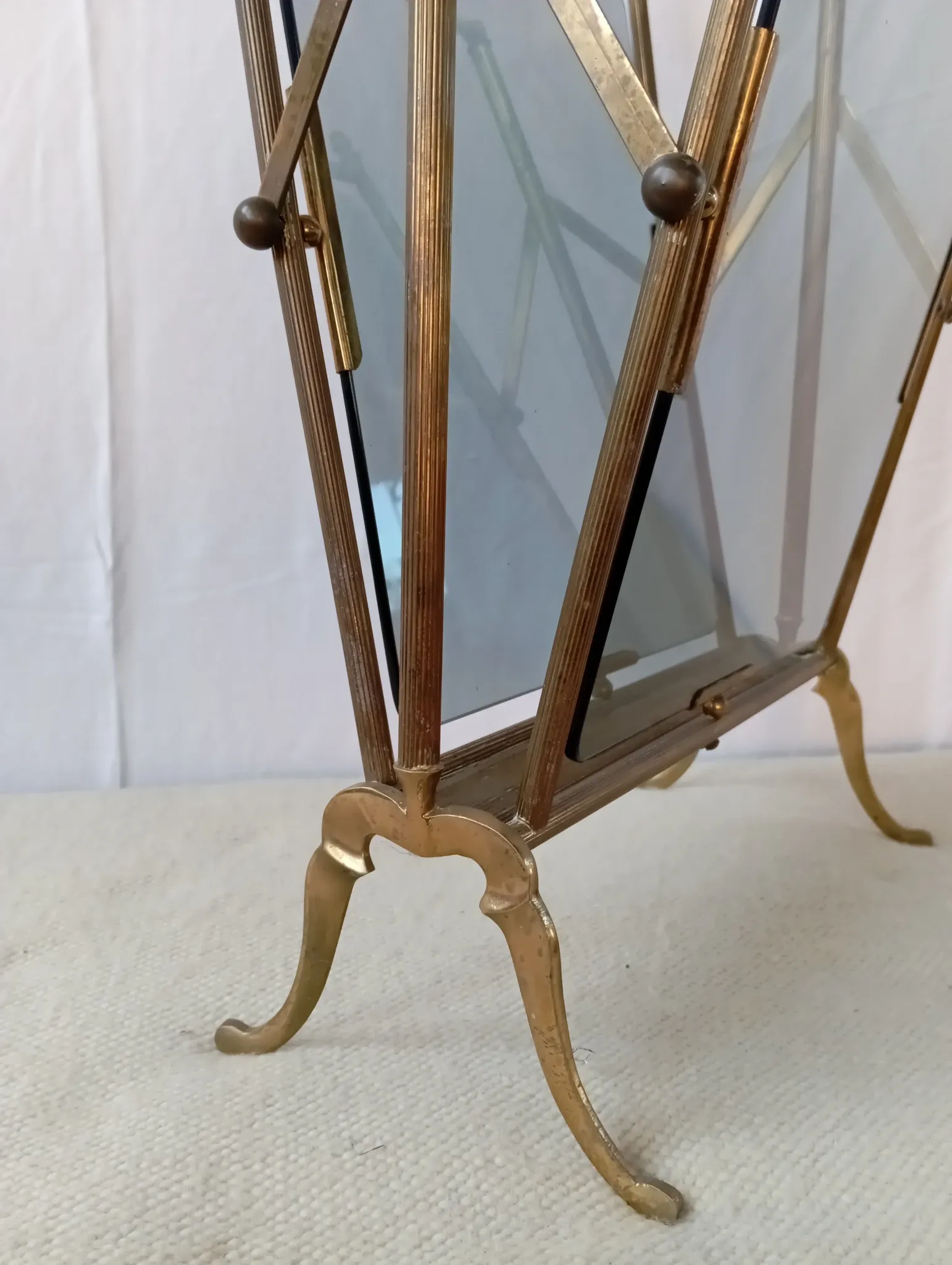 Neo-classical brass magazine rack in the spirit of Maison Jansen.