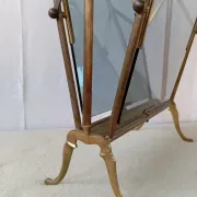 Neo-classical brass magazine rack in the spirit of Maison Jansen.