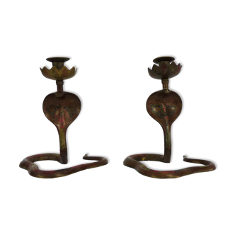 Pair of old bronze cobra candle holders with detailed engraving. Around 1950