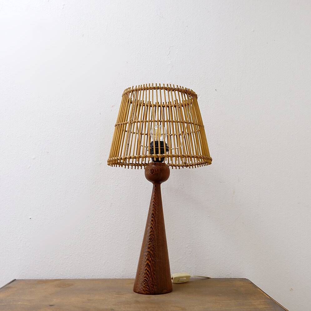 Wooden table lamp in the shape of a bowling pin with a bamboo shade from the 1960s.