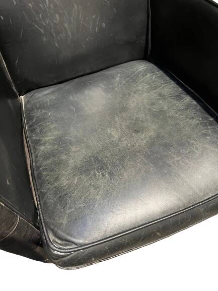 Pair of leather armchairs with marquetry armrests