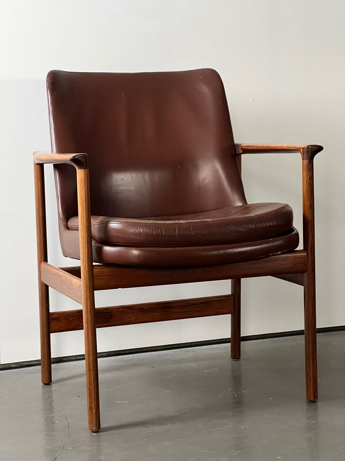 Leather and wood armchair by Ib Kofod Larsen