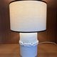 Table lamp in ceramic with a handmade couture-style lampshade from France.