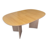 Danish extendable dining table in light solid wood with V-shaped legs.