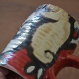 Glazed stoneware mug with snail motif signed