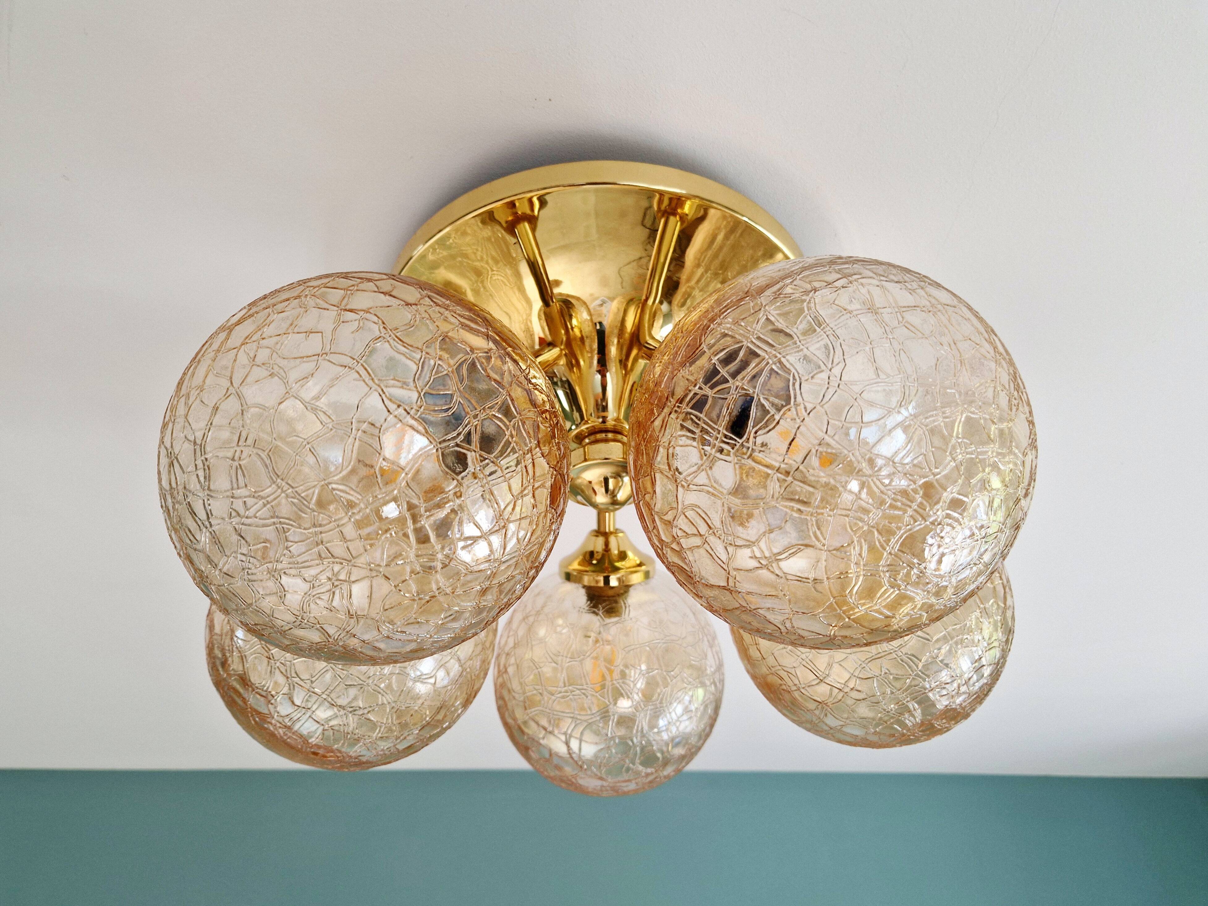 Large designer ceiling light in brass and amber crackled glass, 1970s.