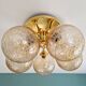 Large designer ceiling light in brass and amber crackled glass, 1970s.