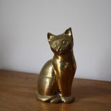 Cat sitting in brass