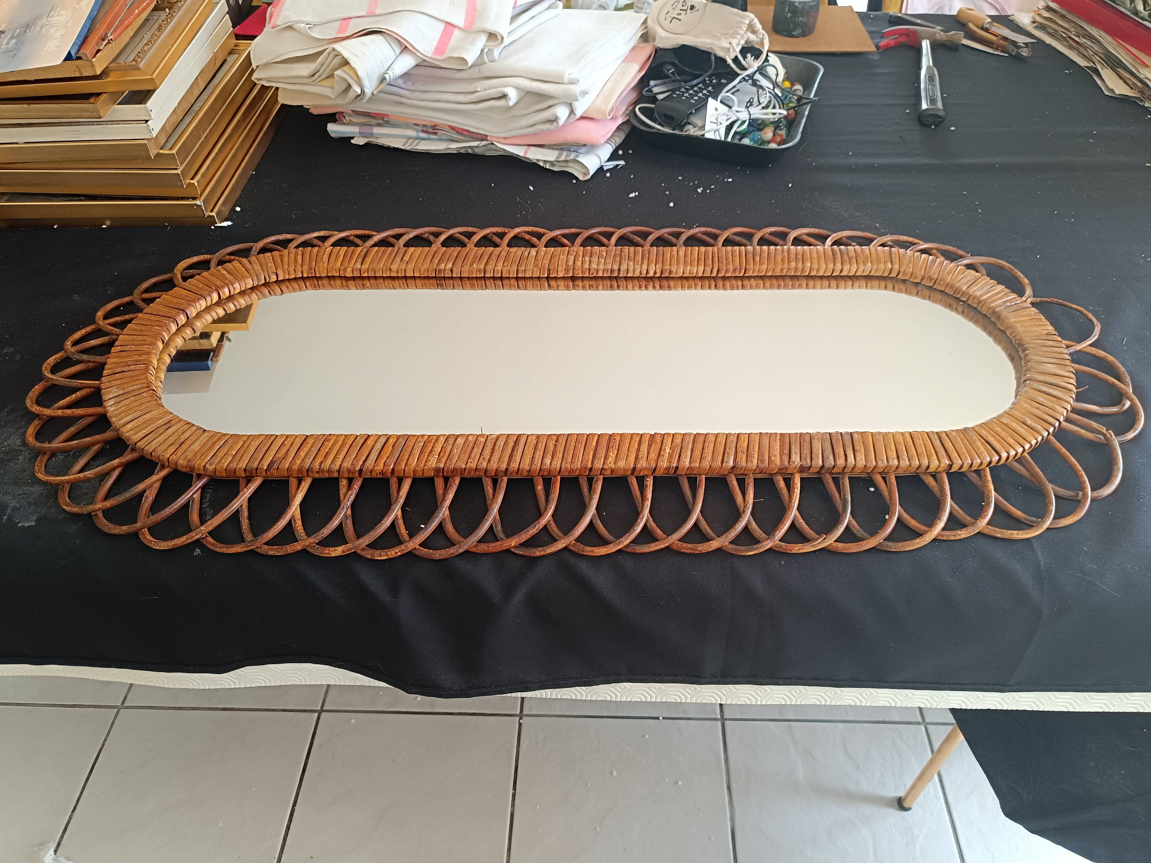 Large oval mirror from the 60s in rattan.