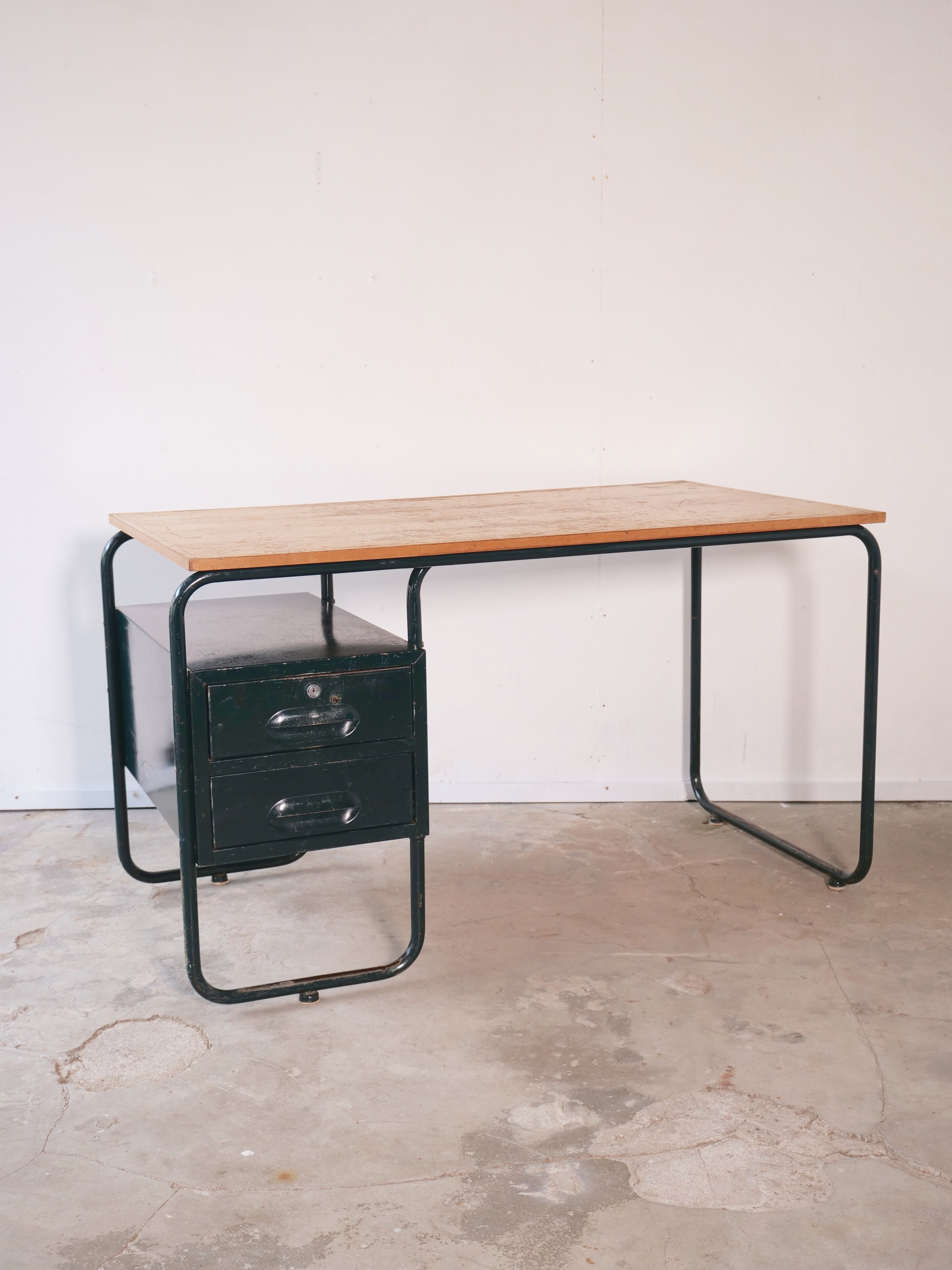 Desk with bauhaus style tubular steel chair