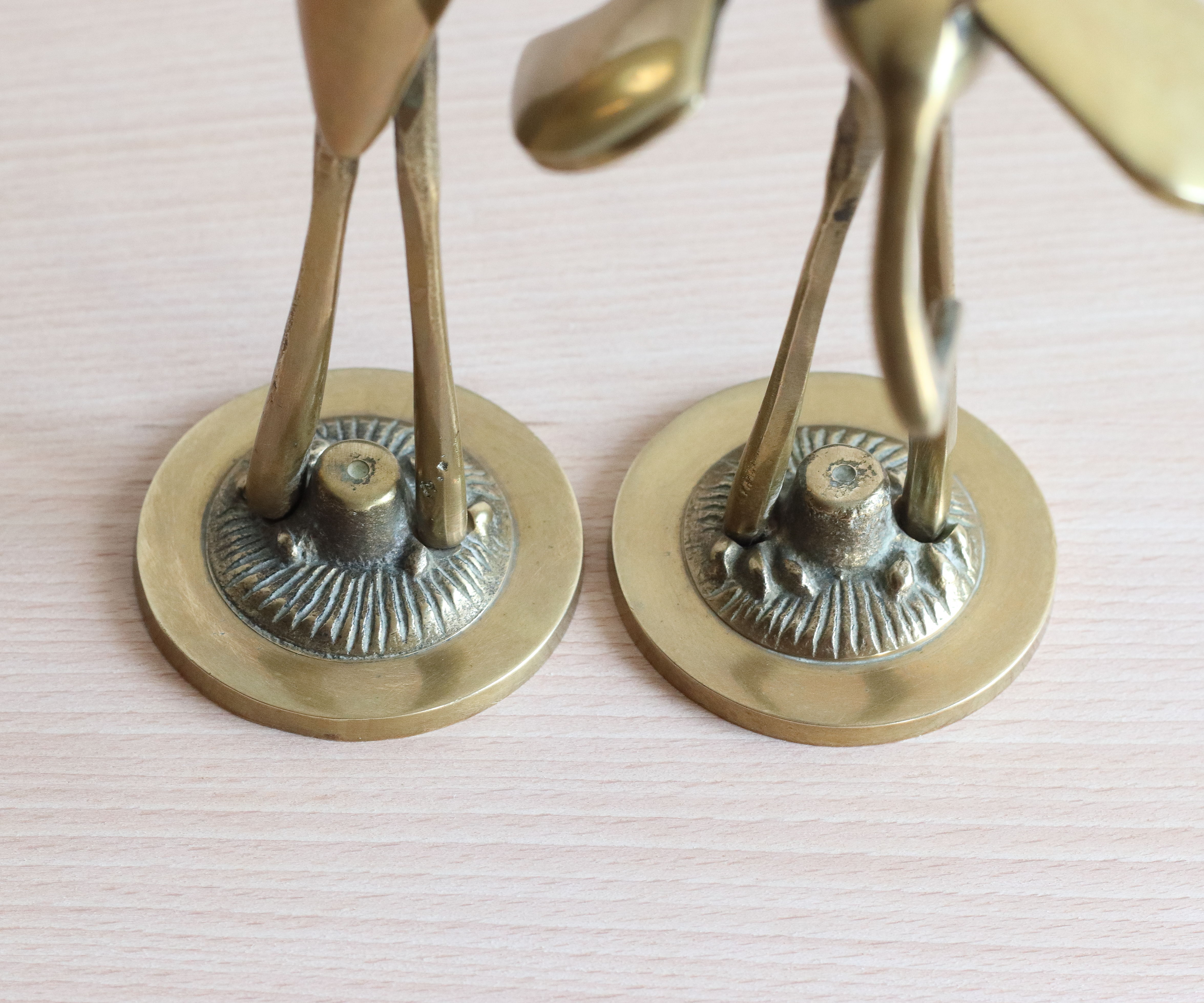 Couple of herons, golden brass