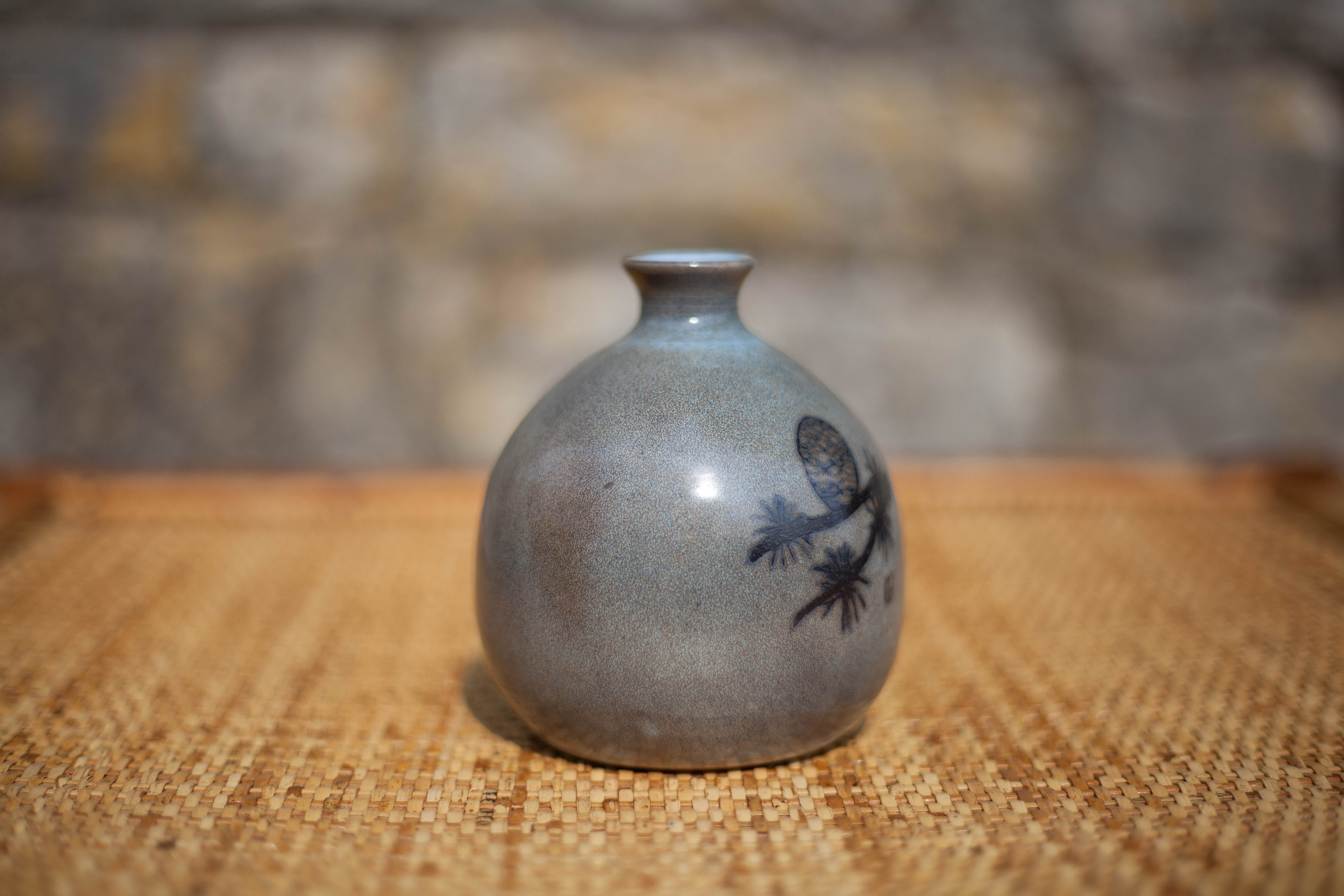 Glazed terracotta ball vase