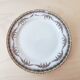Ensemble de 8 assiettes à dessert et un plat Limoges