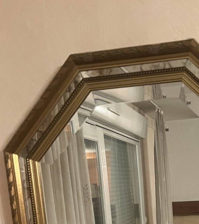 Octagonal mirror with gilded wooden beaded borders