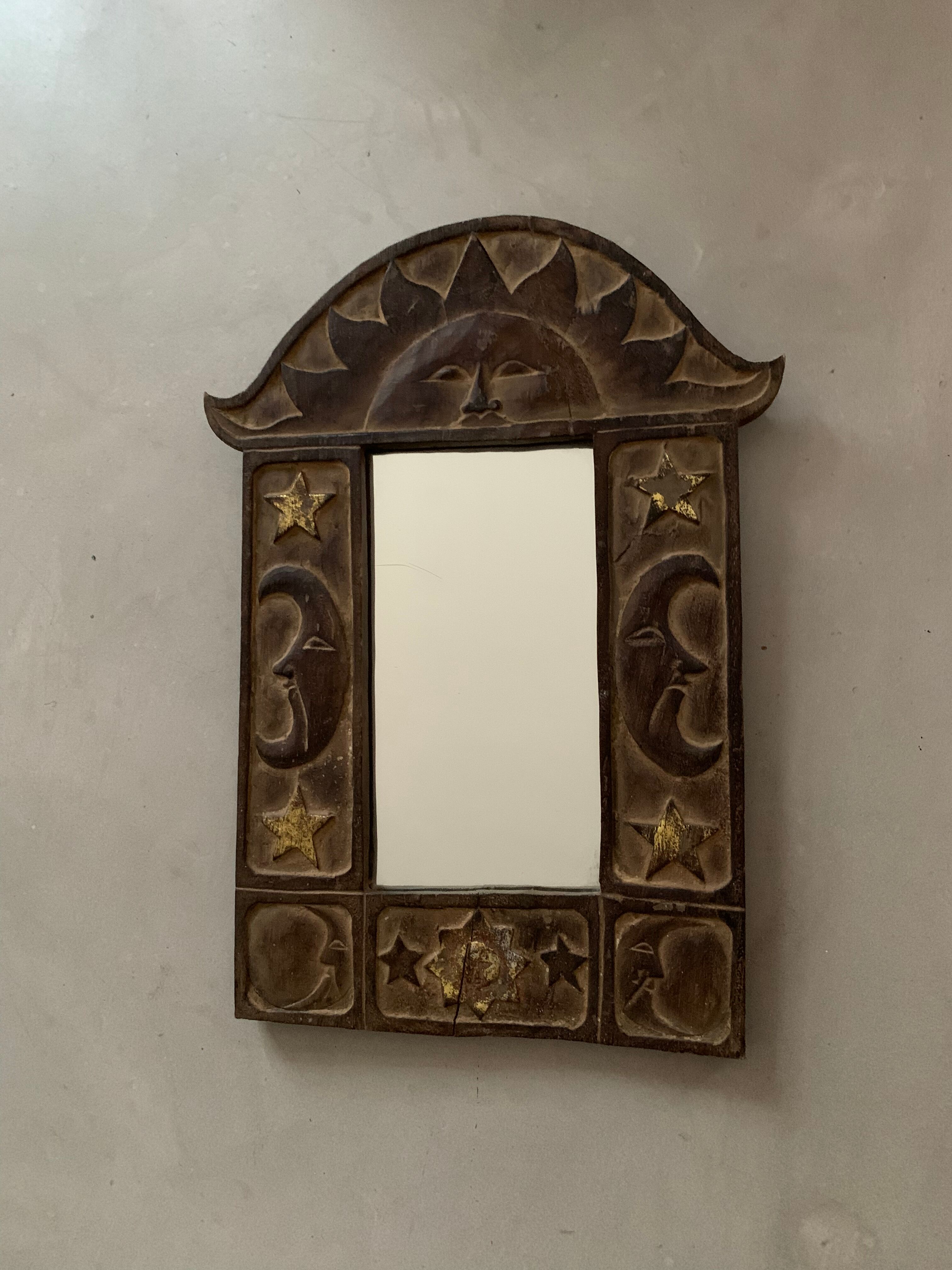 Antique carved wooden mirror