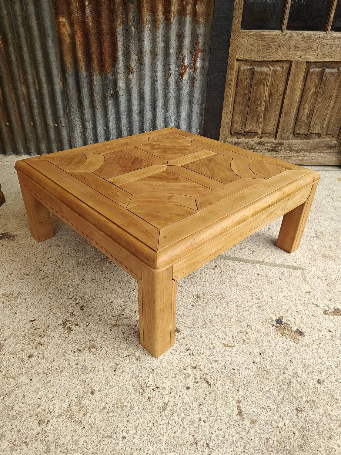 Square coffee table with a drawer in cherry wood.