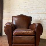 French leather club chair, chapeau de gendarme model, circa 1940