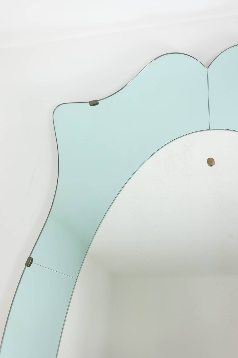 Two-tone glass and gilded brass console mirror. Circa 1950.