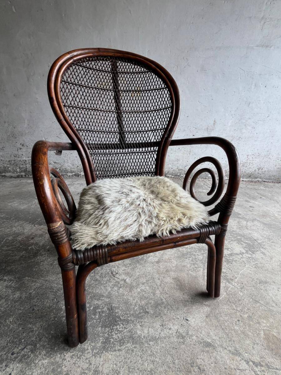 Mid-century Manou dark brown bamboo armchair with open rattan backrest, 1960s French