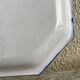 Antique octagonal plate in blue and white pottery with bird decoration.