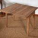 Table portefeuille ancienne extensible en bois massif brut