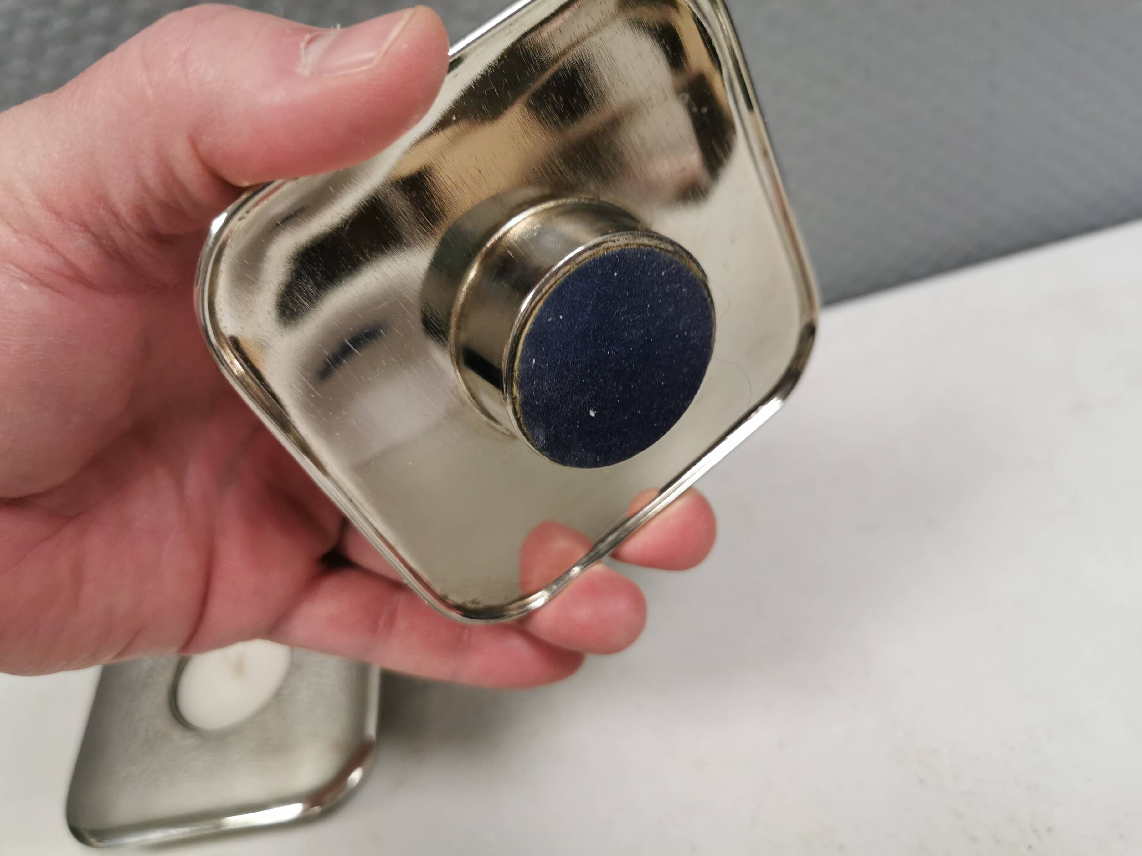 A set of classic Danish candlesticks in polished metal.