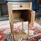 Antique wooden bedside table with marble top