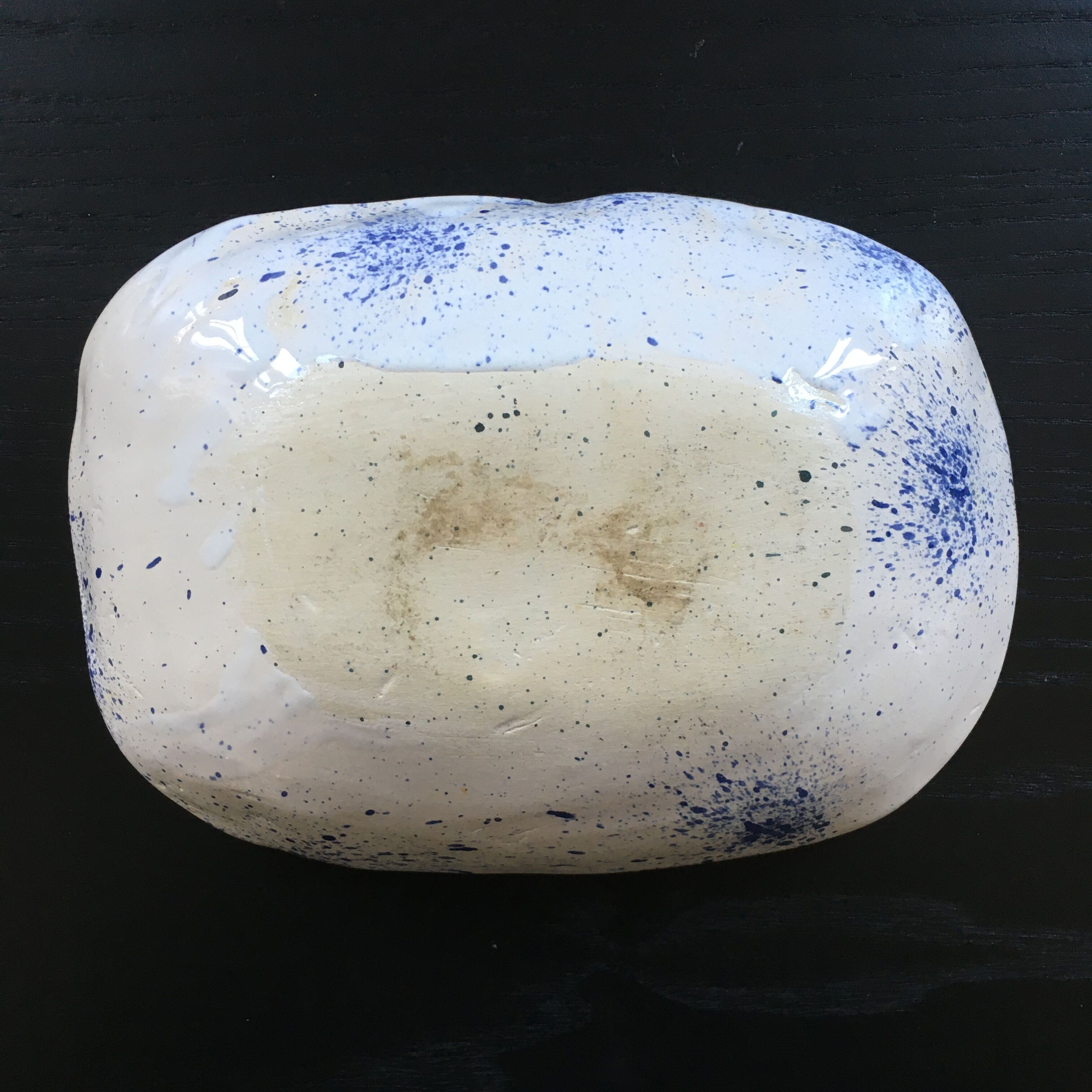 Empty blue speckled white pocket