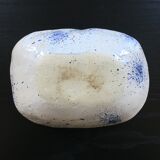 Empty blue speckled white pocket