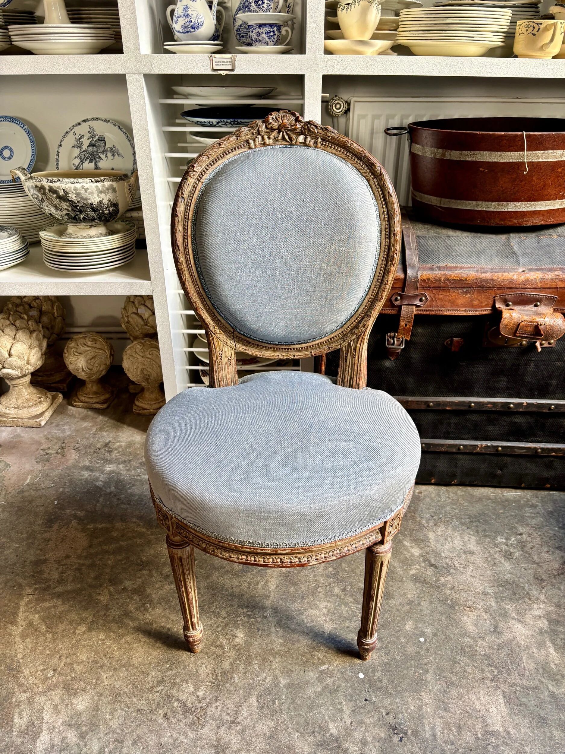 Medallion back chair in reclaimed wood and blue cotton.