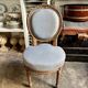 Medallion back chair in reclaimed wood and blue cotton.