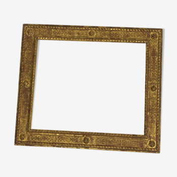 Vintage gilded frame decorated with stylized flowers
