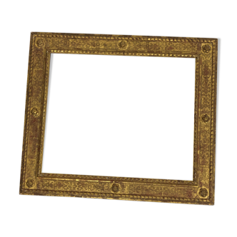 Vintage gilded frame decorated with stylized flowers