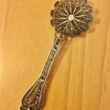 silver sprinkler spoon