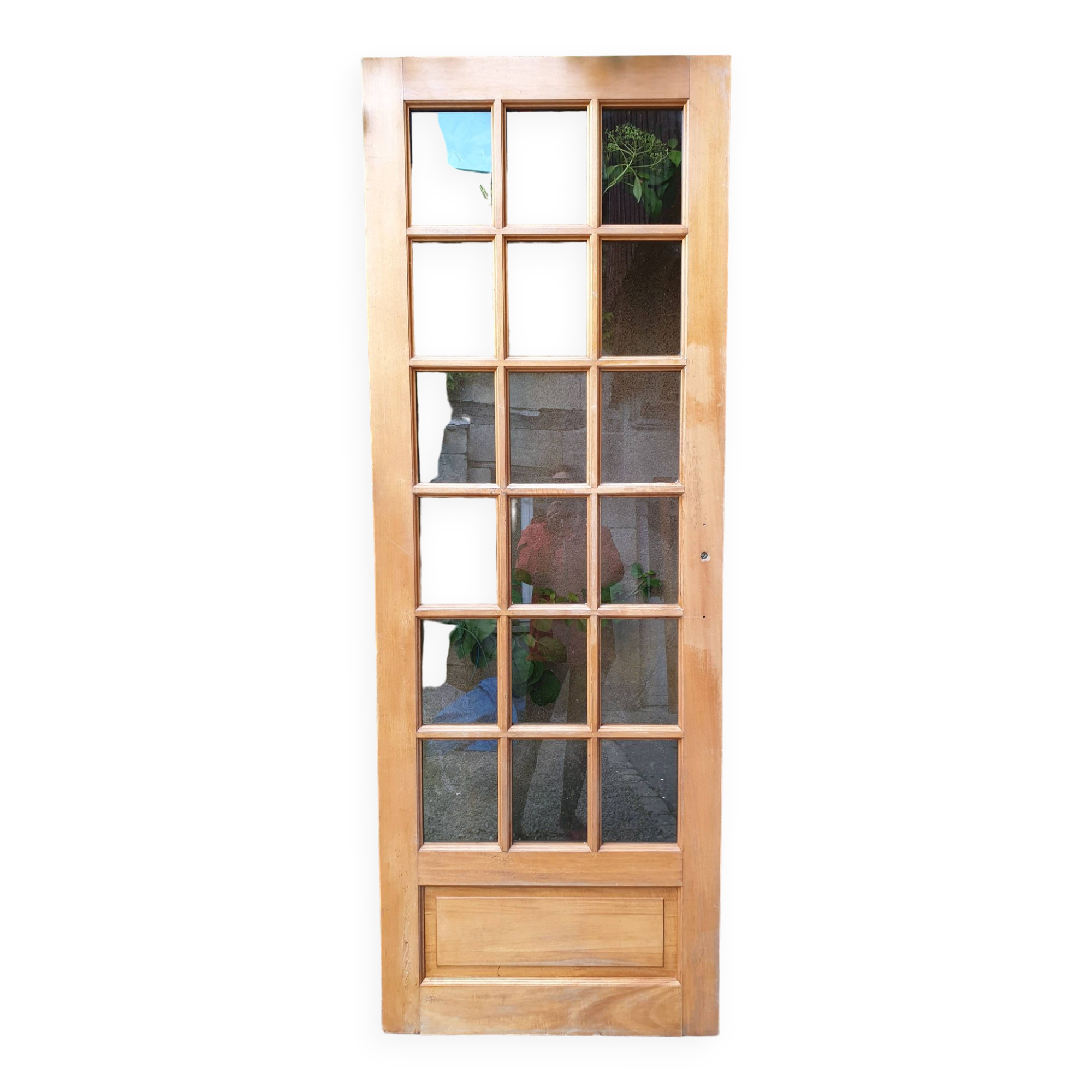 Old wooden door glazed with small tiles