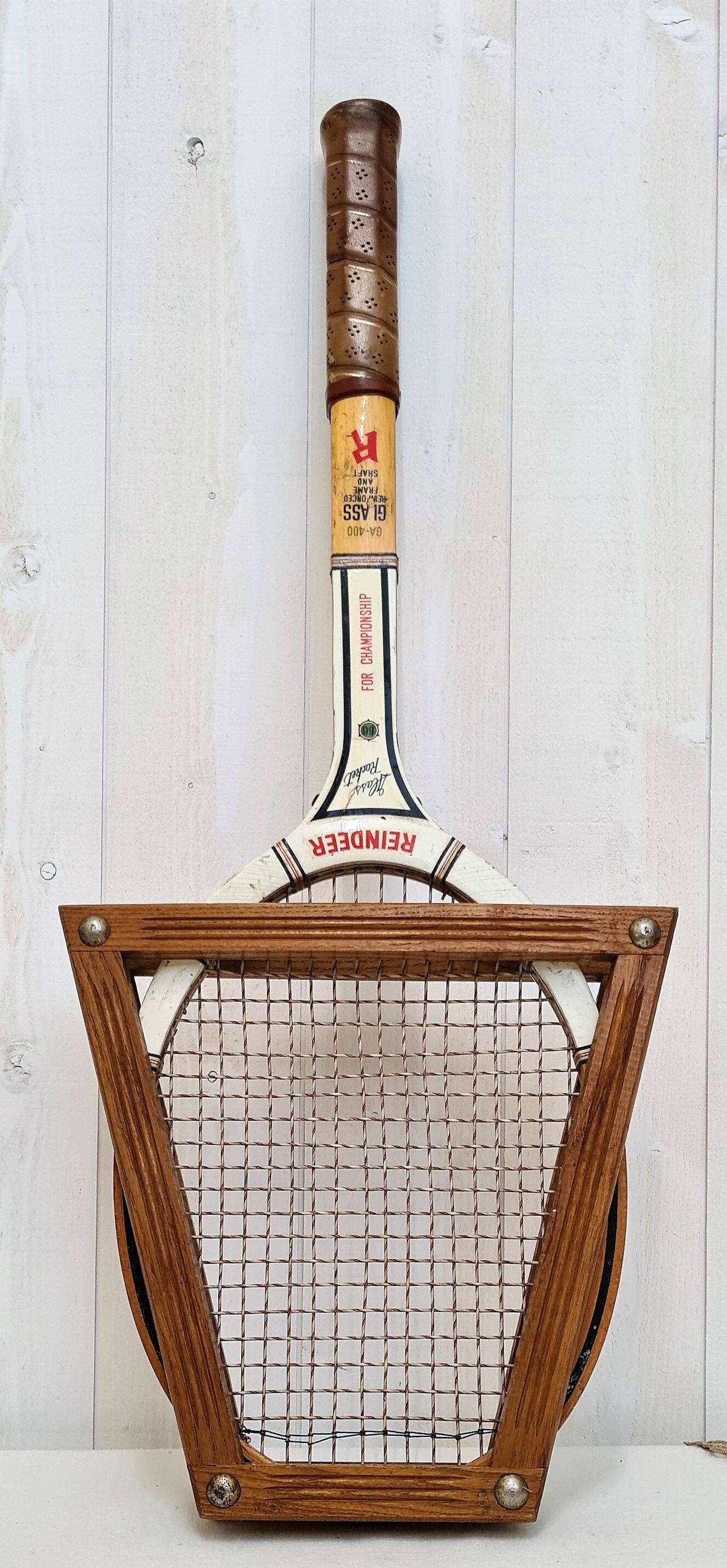 Vintage tennis racket with wooden press