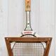 Vintage tennis racket with wooden press