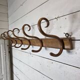 Curved wooden coat rack with 6 hooks